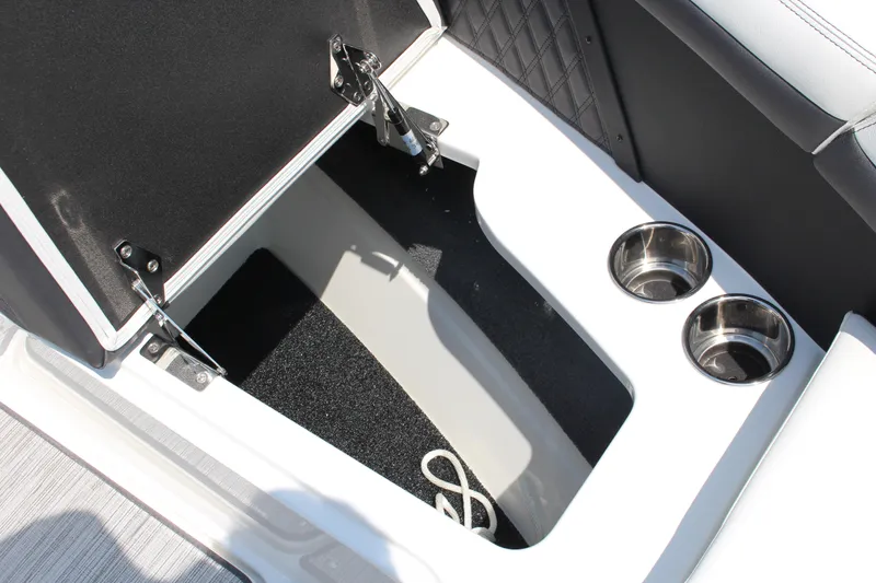 Slide: The Image of 2025 Cobalt R8 boat storage compartment with cup holders and rope. - 16