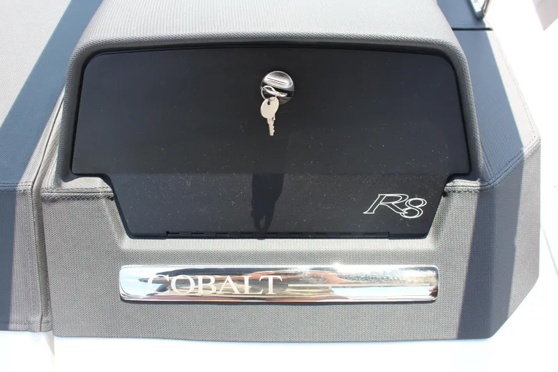 Slide: The Image of 2025 Cobalt R8 boat dashboard with key in ignition, featuring sleek design elements. - 18