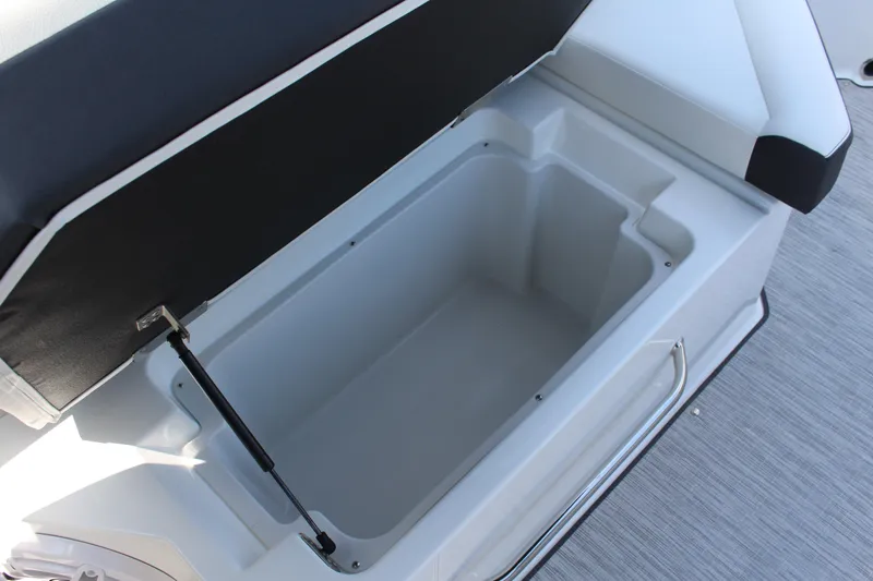 Slide: The Image of 2025 Cobalt R8 boat storage compartment with open lid and hydraulic support. - 22