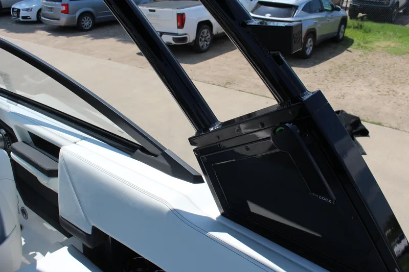 Slide: The Image of 2025 Cobalt R8 boat interior with sleek white seating and modern design elements. - 25