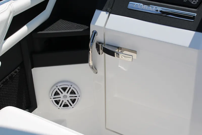 Slide: The Image of Interior of 2025 Cobalt R8 boat featuring sleek design and audio speaker. - 30
