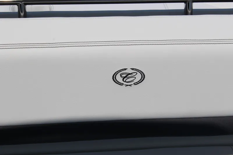 Slide: The Image of 2025 Cobalt R8 boat seat with embroidered logo on white upholstery. - 32