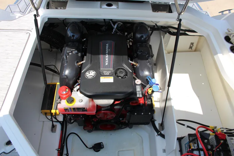 Slide: The Image of 2025 Cobalt R8 engine compartment featuring a Volvo Penta 350 V8 engine. - 33