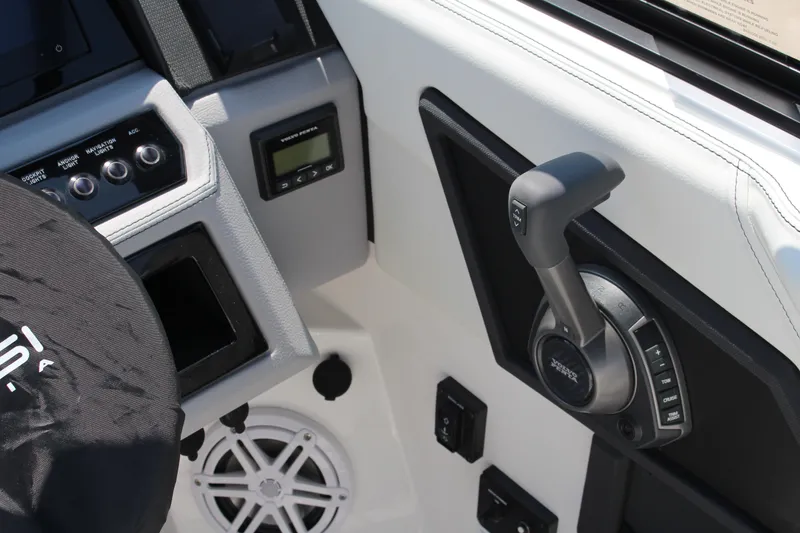 Slide: The Image of 2025 Cobalt R8 boat dashboard with controls and steering wheel cover. - 34