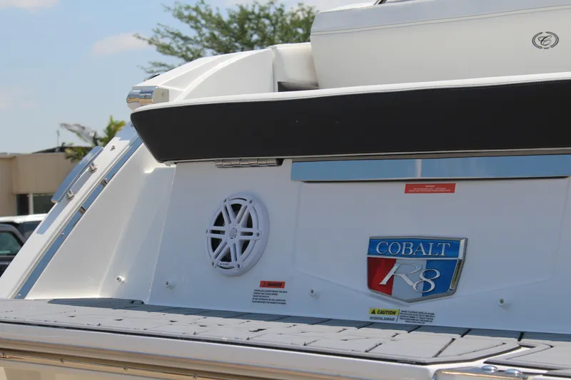 Slide: The Image of 2025 Cobalt R8 boat rear view with logo and speaker detail. - 37