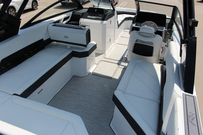Slide: The Image of 2025 Cobalt R8 boat interior with luxurious white seating and modern dashboard. - 42