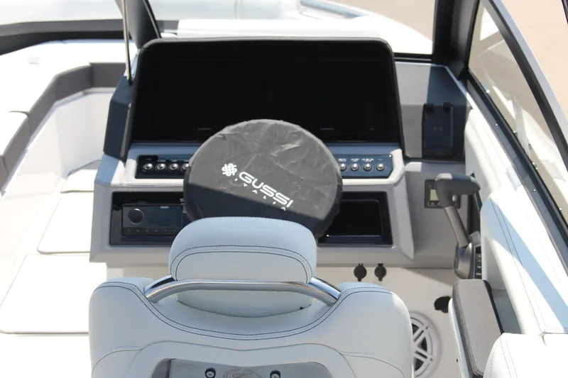 Slide: The Image of 2025 Cobalt R8 boat cockpit with Gussi steering wheel cover and modern controls. - 43