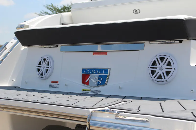 Slide: The Image of 2025 Cobalt R8 boat rear view with speakers and logo. - 5
