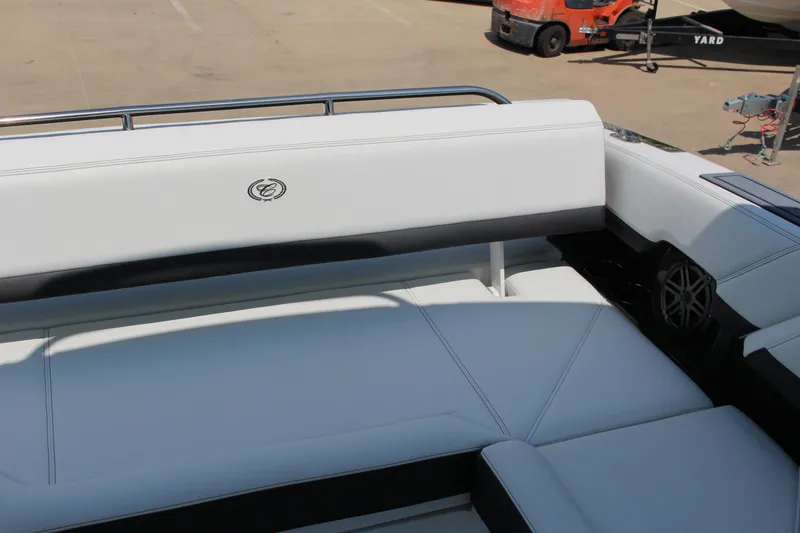 Slide: The Image of 2025 Cobalt R8 boat interior with white leather seating and sleek design. - 9
