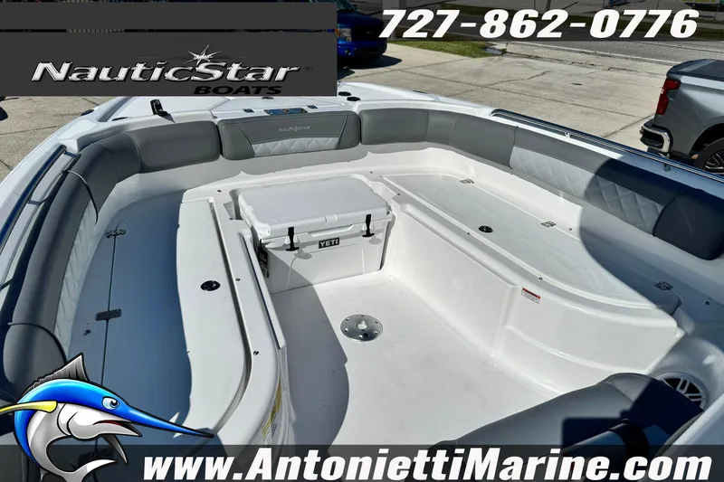 Slide: The Image of 2026 NauticStar 251 Hybrid boat interior with seating and Yeti cooler. - 13