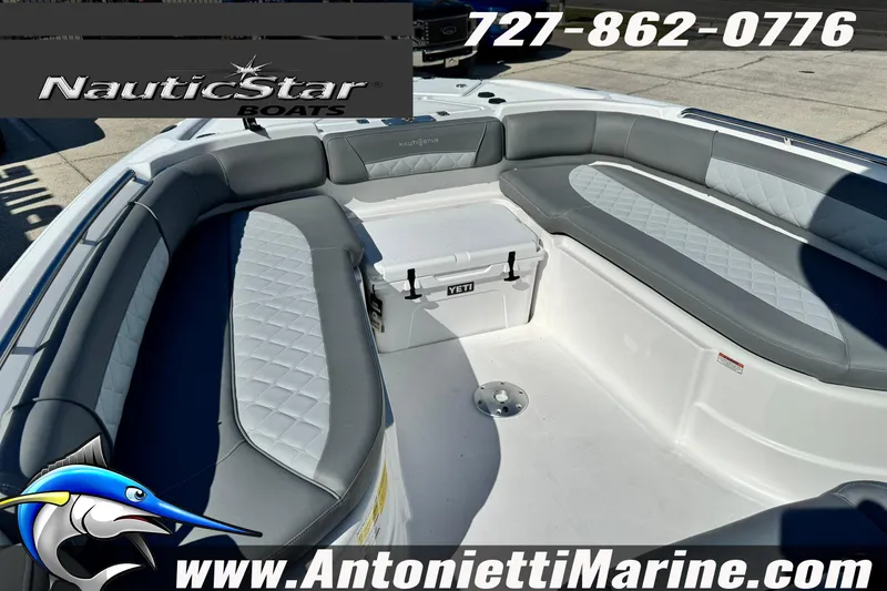 Slide: The Image of 2026 NauticStar 251 Hybrid boat interior with cushioned seating and Yeti cooler. - 15