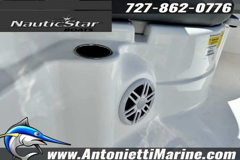 Slide: The Image of 2026 NauticStar 251 Hybrid boat interior with speaker and cup holder, Antonietti Marine branding. - 20