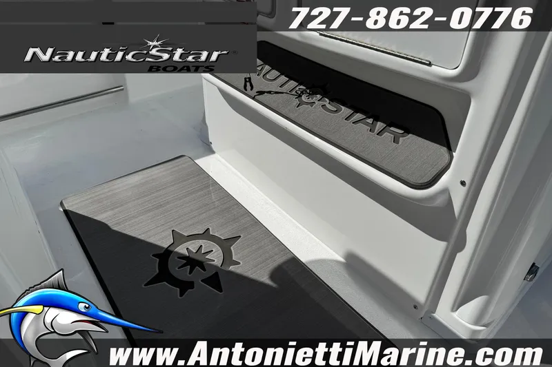 Slide: The Image of 2026 NauticStar 251 Hybrid boat interior with branded mats and contact details. - 21