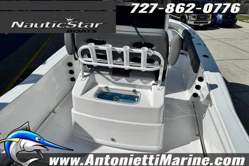 Slide: The Image of 2026 NauticStar 251 Hybrid boat interior with rod holders and livewell, displayed at Antonietti Marine. - 28