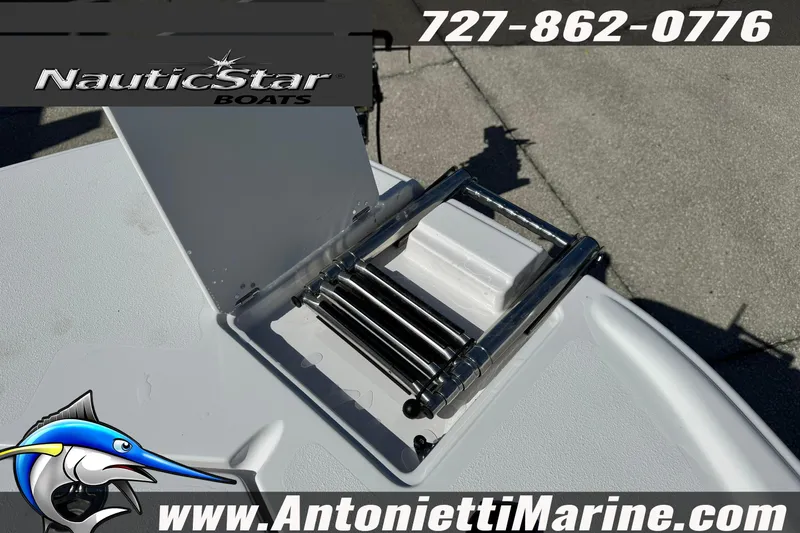 Slide: The Image of 2026 NauticStar 251 Hybrid boat ladder detail with contact information and logo. - 36