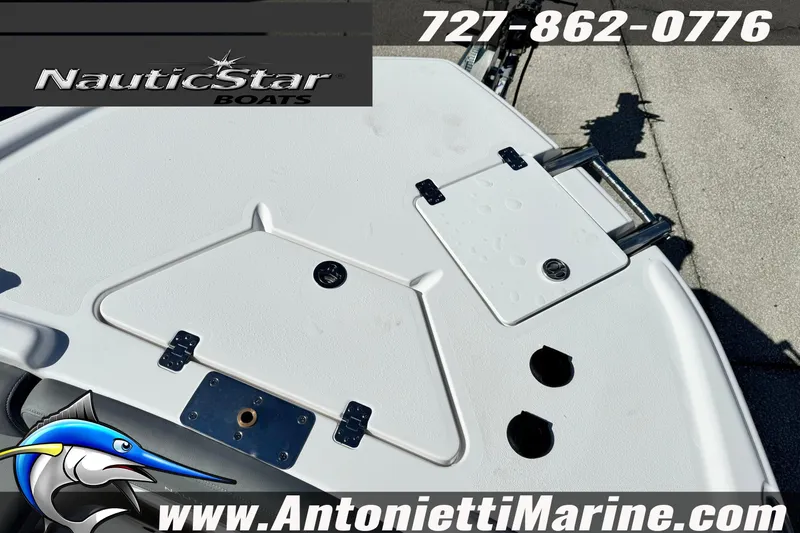 Slide: The Image of NauticStar 251 Hybrid 2026 boat deck with storage compartments and fishing rod holders. - 38
