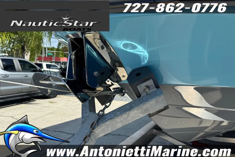 Slide: The Image of 2026 NauticStar 251 Hybrid boat on trailer at Antonietti Marine dealership. - 41