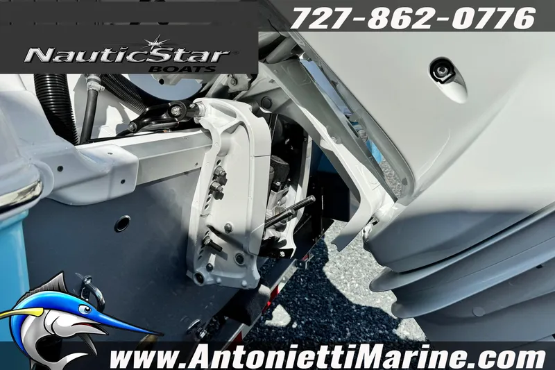 Slide: The Image of 2026 NauticStar 251 Hybrid boat engine detail with contact information and logo. - 6