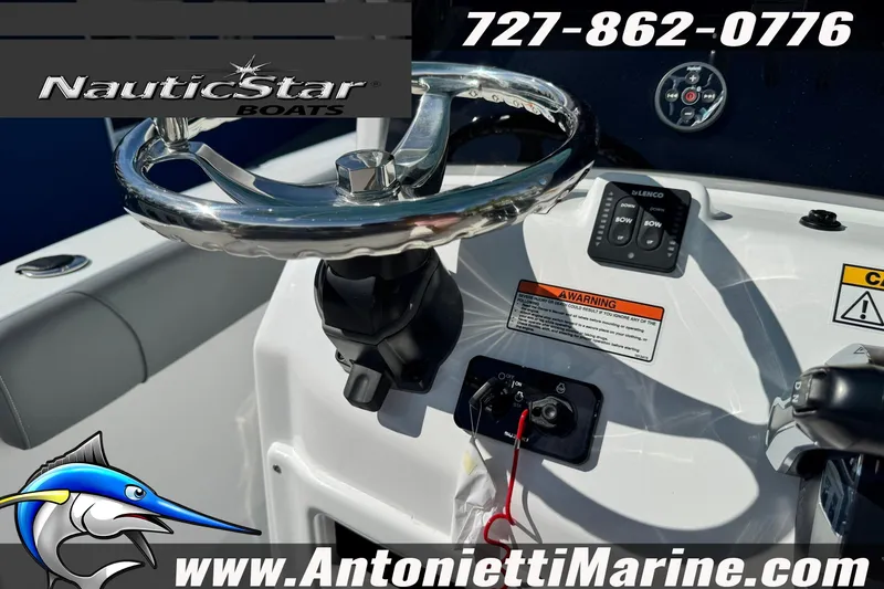 Slide: The Image of 2026 NauticStar 251 Hybrid boat steering console with controls and branding. - 8