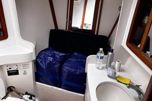 Slide: The Image of Interior of 1992 Catalina 42' MkII sailboat with sink and storage area. - 15