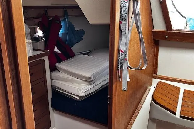 Slide: The Image of Interior cabin of a 1992 Catalina 42' MkII sailboat with cushions and life jackets. - 17