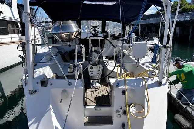 Slide: The Image of 1992 Catalina 42' MkII sailboat docked, featuring spacious cockpit and modern equipment. - 3
