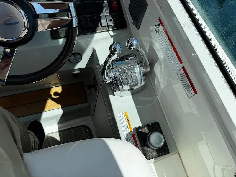 Slide: The Image of 2010 Sea Ray 470 Sundancer yacht near coastal town. - 13