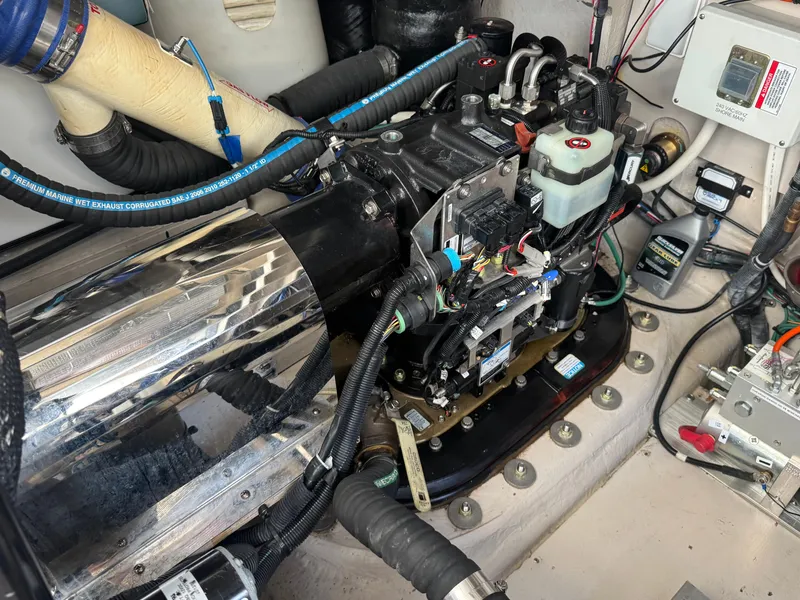 Slide: The Image of Engine room of 2010 Sea Ray 470 Sundancer, showcasing technical details. - 44