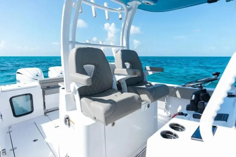 Slide: The Image of 2026 Sportsman Open 302 Center Console boat interior with ocean view. - 14
