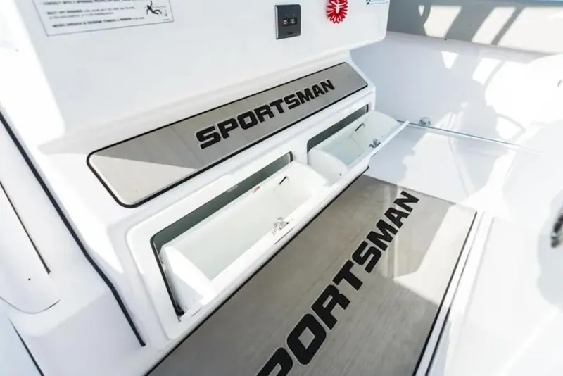 Slide: The Image of 2026 Sportsman Open 302 Center Console interior with storage compartments. - 15