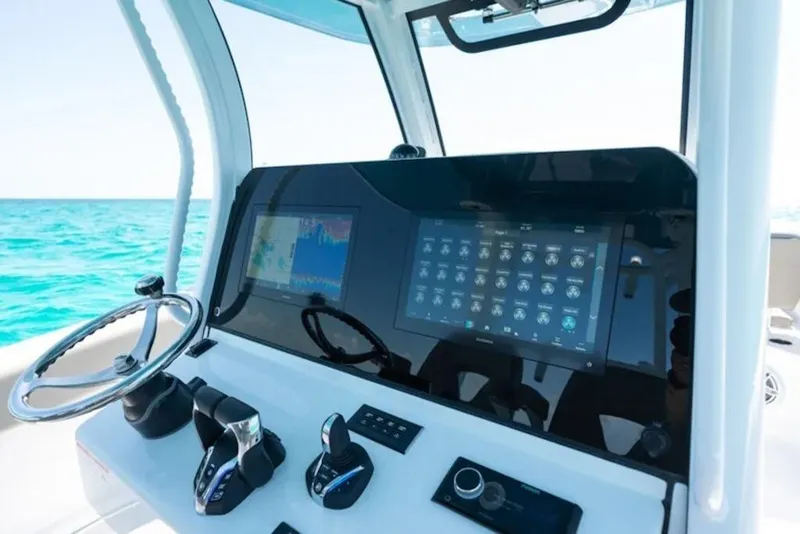 Slide: The Image of 2026 Sportsman Open 302 Center Console dashboard with advanced navigation and control systems. - 17