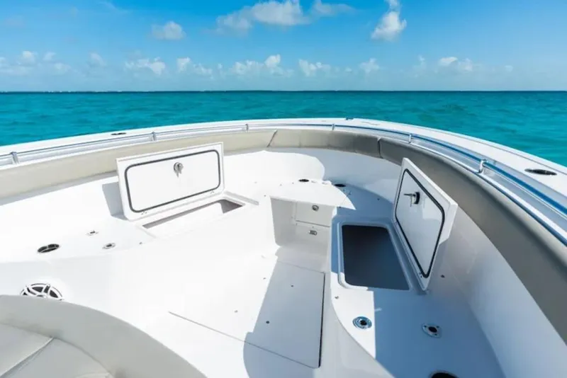 Slide: The Image of 2026 Sportsman Open 302 Center Console boat interior with open storage compartments. - 9
