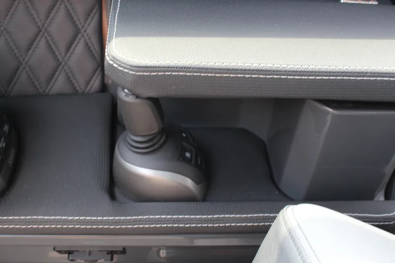 Slide: The Image of Interior of 2025 Cobalt R33 featuring joystick control and quilted upholstery. - 11