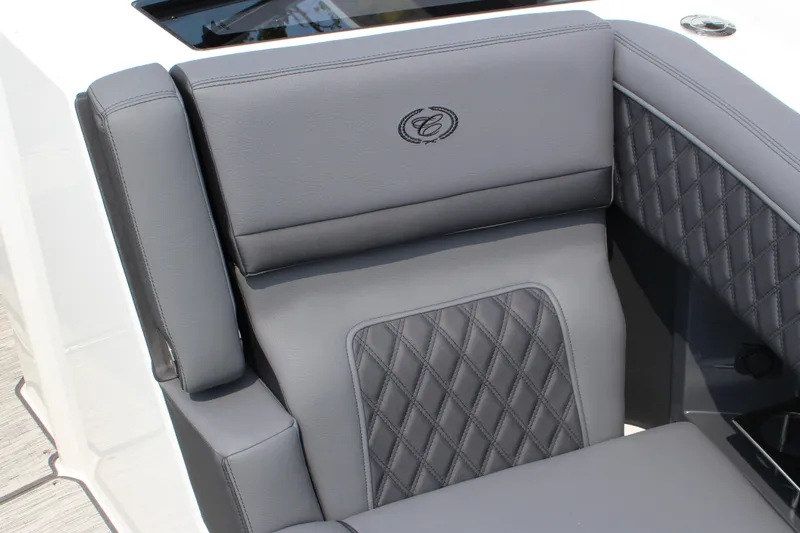 Slide: The Image of Luxurious gray seating in 2025 Cobalt R33 boat with diamond stitching and logo. - 14