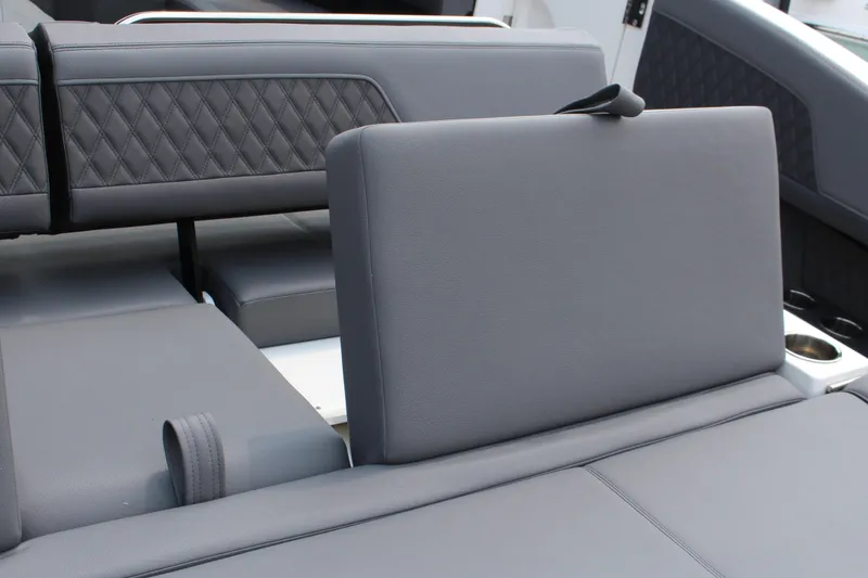 Slide: The Image of 2025 Cobalt R33 boat interior with gray leather seating and diamond stitching. - 17