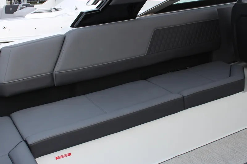 Slide: The Image of 2025 Cobalt R33 boat interior with sleek gray seating and modern design. - 20