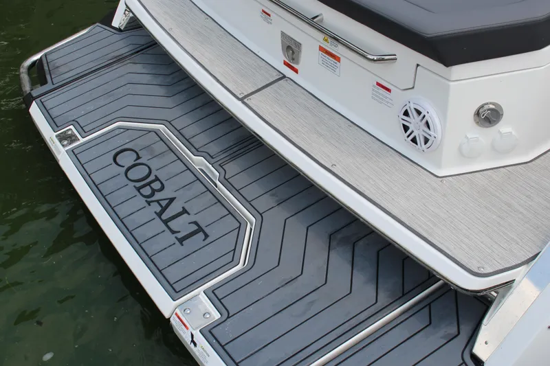 Slide: The Image of Rear view of 2025 Cobalt R33 boat with stylish deck design. - 28