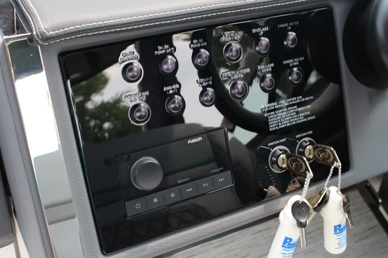 Slide: The Image of Control panel of 2025 Cobalt R33 boat with ignition keys and switches. - 29