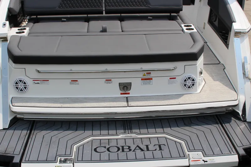 Slide: The Image of 2025 Cobalt R33 boat rear seating area with speakers and swim platform. - 30