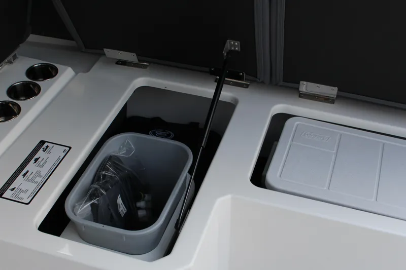 Slide: The Image of 2025 Cobalt R33 boat storage compartments with cooler and accessories. - 31