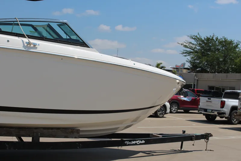 Slide: The Image of 2025 Cobalt R33 boat on trailer in parking lot, sunny day. - 38