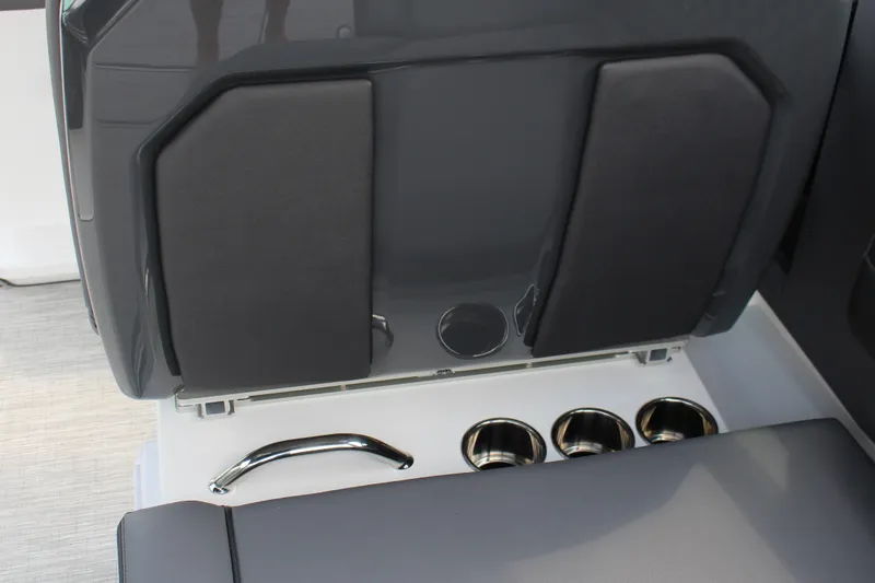 Slide: The Image of 2025 Cobalt R33 boat interior with cup holders and sleek seating design. - 4