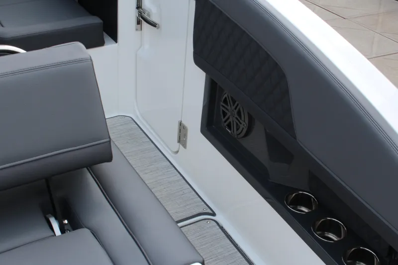 Slide: The Image of Interior of 2025 Cobalt R33 boat with gray seating and cup holders. - 42