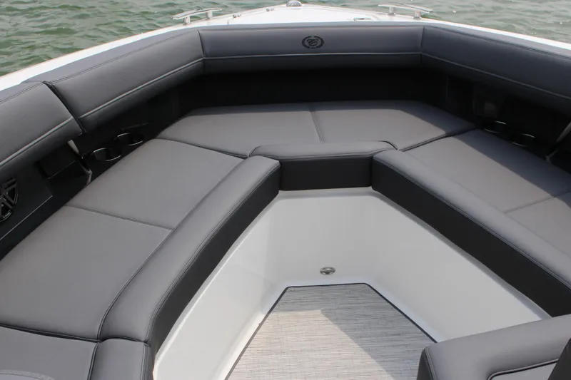 Slide: The Image of Luxurious seating area on 2025 Cobalt R33 boat, featuring sleek gray upholstery. - 48