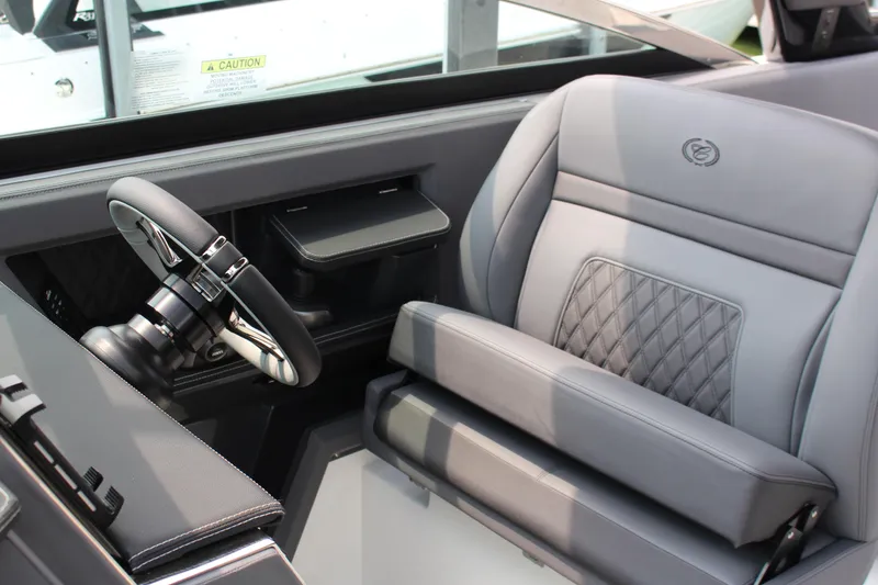 Slide: The Image of 2025 Cobalt R33 interior with luxury gray seating and modern steering wheel design. - 5