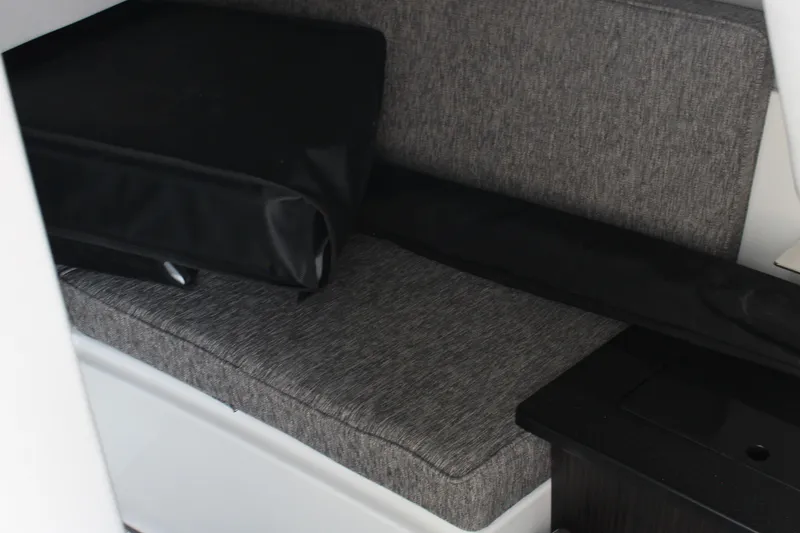 Slide: The Image of Interior seating of 2025 Cobalt R33 boat with gray upholstery. - 50