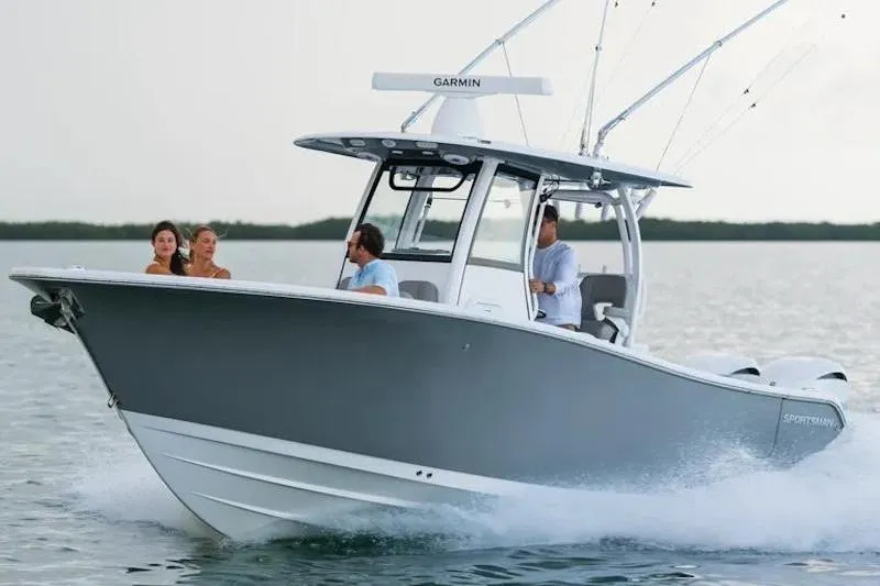 Slide: The Image of 2026 Sportsman Open 282 boat cruising on water with passengers enjoying the ride. - 1