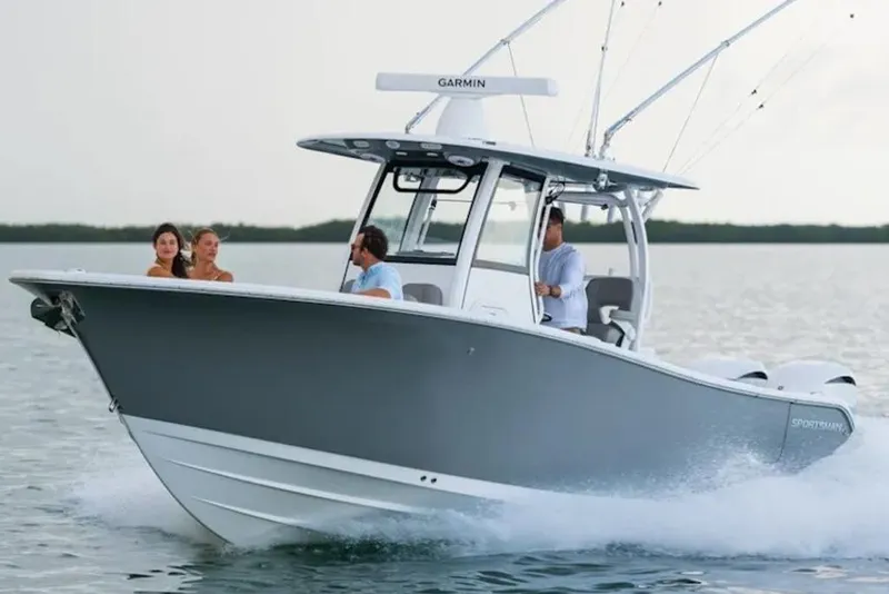 Slide: The Image of 2026 Sportsman Open 282 boat cruising on water with passengers enjoying the ride. - 10