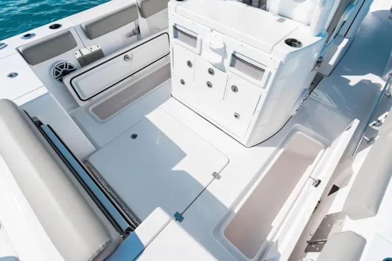 Slide: The Image of 2026 Sportsman Open 282 boat interior with storage compartments and seating. - 13