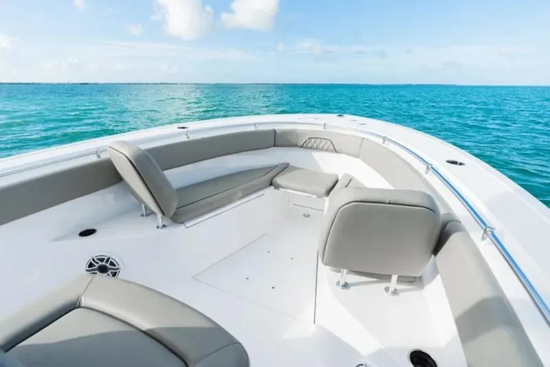 Slide: The Image of 2026 Sportsman Open 282 boat interior with gray seating, ocean view. - 2